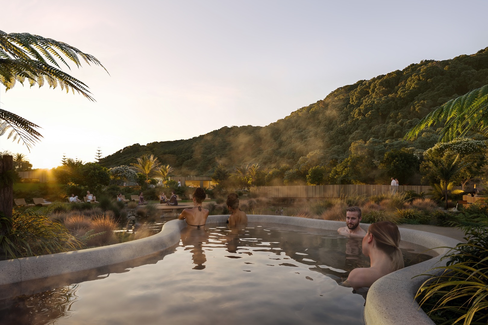 Sunrise over the Waiwera Thermal Springs, where guests soak in geothermal waters surrounded by native planting and the sheltering hills of the Hibiscus Coast.